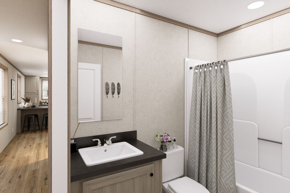 The 6616-CC03 HARBORVIEW 66 Guest Bathroom. This Manufactured Mobile Home features 3 bedrooms and 2 baths.
