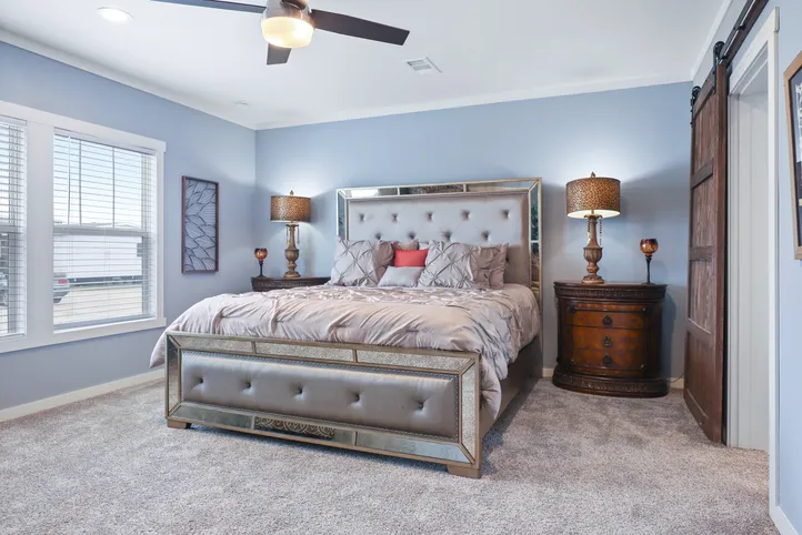 The THE ATLAS Primary Bedroom. This Manufactured Mobile Home features 4 bedrooms and 3 baths.