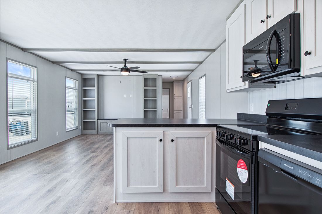 The ANNIVERSARY 16682A Kitchen. This Manufactured Mobile Home features 2 bedrooms and 2 baths.