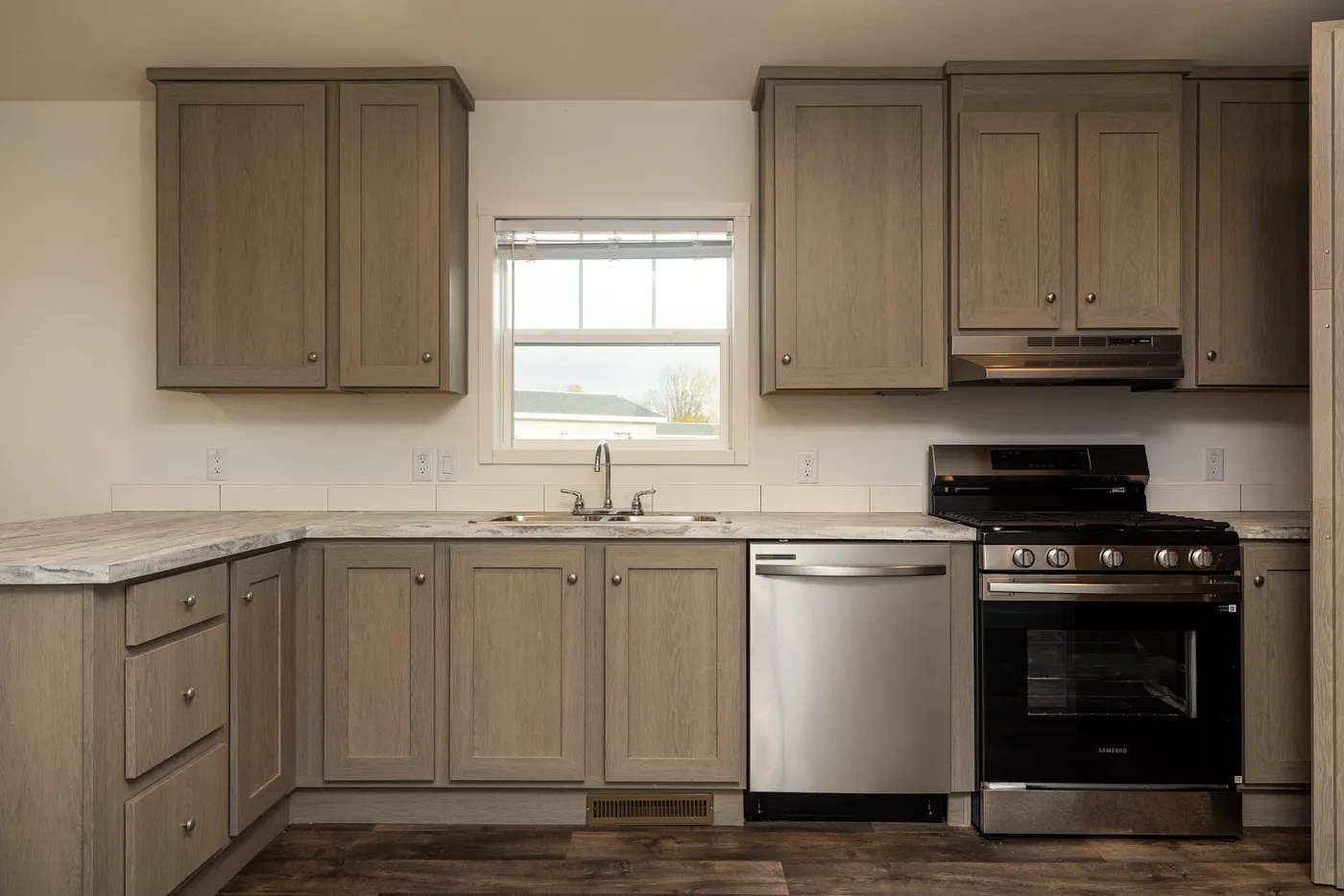 The RAMSEY 223 Kitchen. This Manufactured Mobile Home features 3 bedrooms and 2 baths.