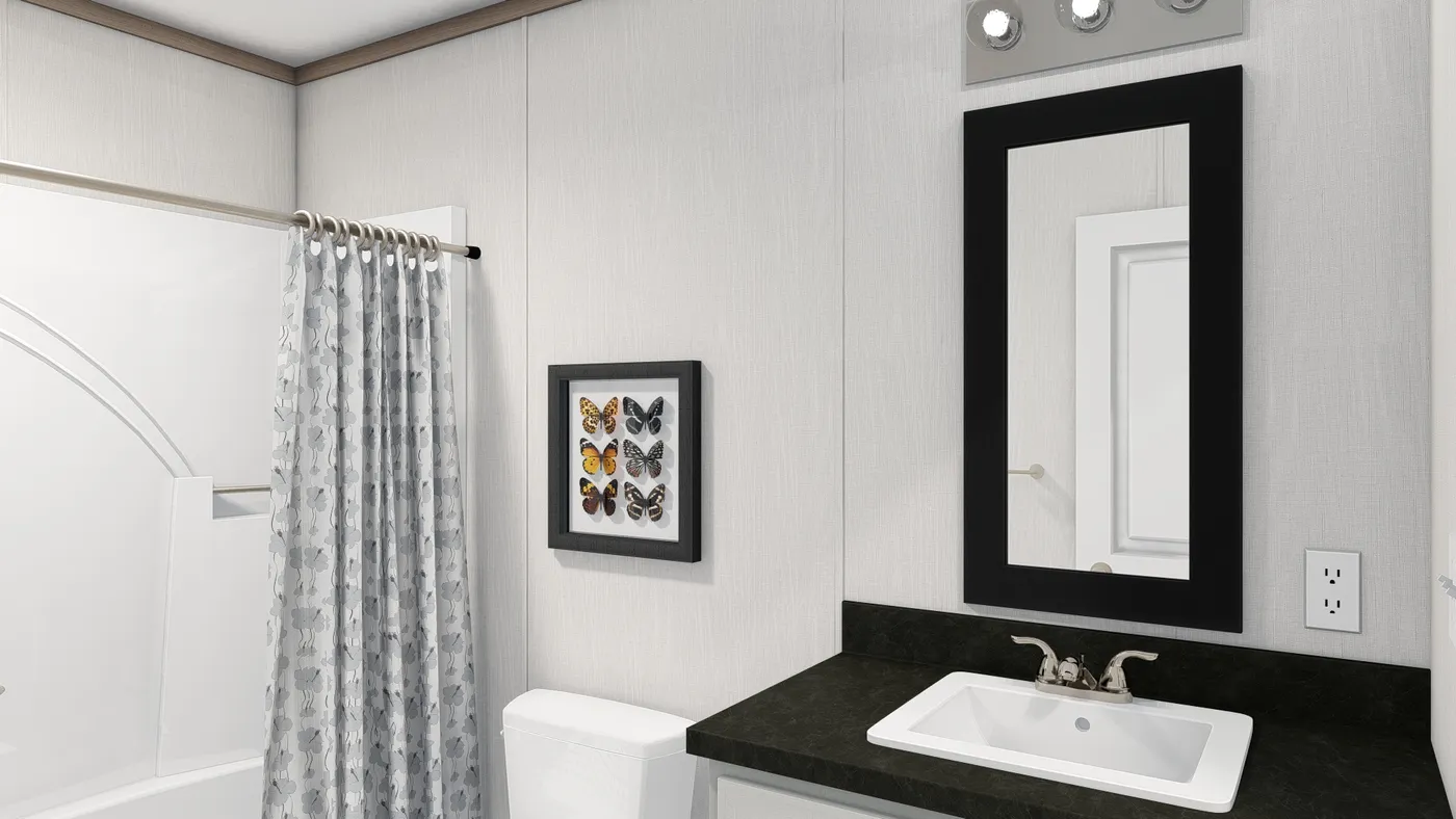 The 4428-E781 THE PULSE Guest Bathroom. This Manufactured Mobile Home features 3 bedrooms and 2 baths.