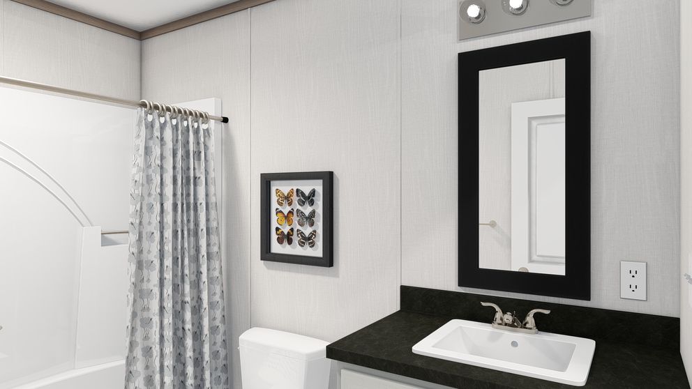 The 4428-E781 THE PULSE Guest Bathroom. This Manufactured Mobile Home features 3 bedrooms and 2 baths.