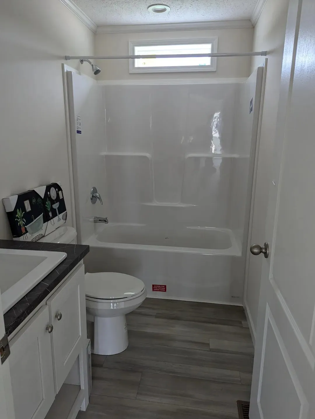 The MOONSTONE Guest Bathroom. This Manufactured Mobile Home features 3 bedrooms and 2 baths.