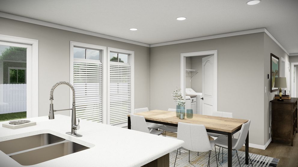 The THE WASHINGTON Dining Area. This Manufactured Mobile Home features 3 bedrooms and 2 baths.