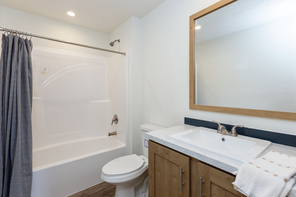 The THE ANTHONY Guest Bathroom. This Manufactured Mobile Home features 2 bedrooms and 2 baths.
