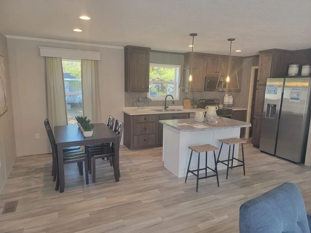 The AMETHYST 52 Dining Area. This Manufactured Mobile Home features 3 bedrooms and 2 baths.