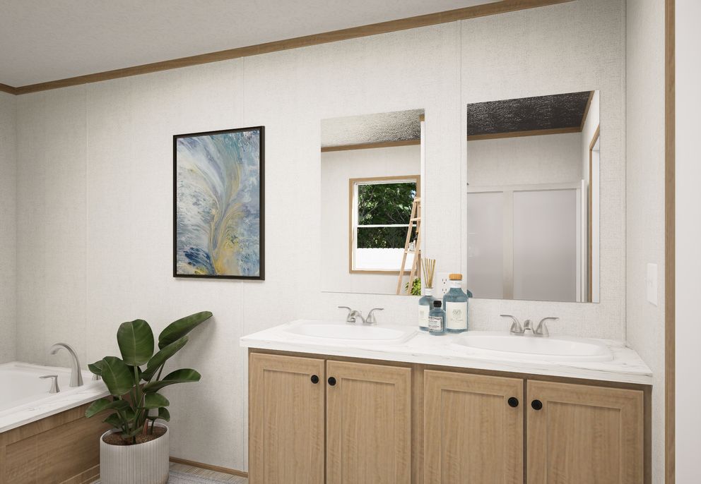 The THE MOUNTAINEER 68 Primary Bathroom. This Manufactured Mobile Home features 4 bedrooms and 2 baths.