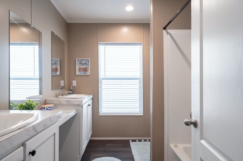 The ISLAND BREEZE 64 Guest Bathroom. This Manufactured Mobile Home features 4 bedrooms and 2 baths.