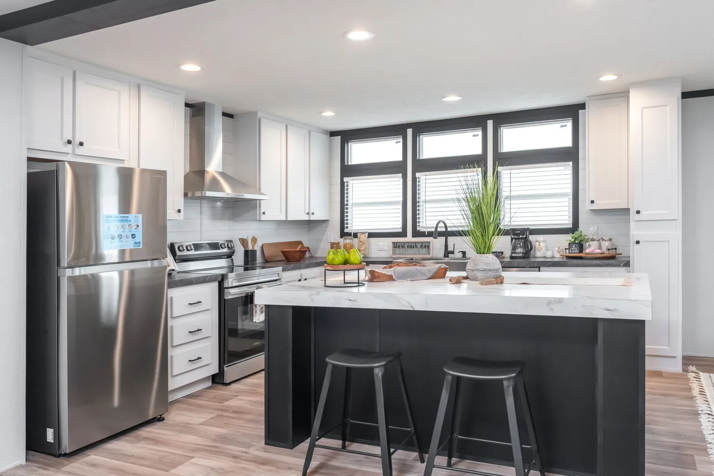 The ABSOLUTE VALUE Kitchen. This Manufactured Mobile Home features 4 bedrooms and 2 baths.