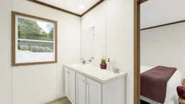 The DYNAMIC Primary Bathroom. This Manufactured Mobile Home features 3 bedrooms and 2 baths.