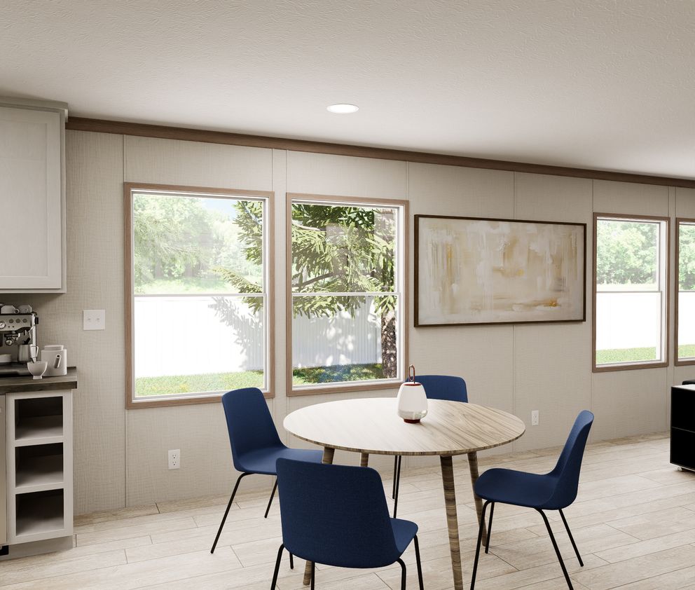 The ULTRA FLEX 60 Dining Area. This Manufactured Mobile Home features 3 bedrooms and 2 baths.