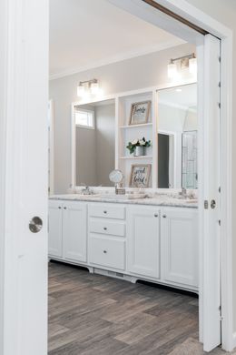 The SUPER 68 ELITE Primary Bathroom. This Manufactured Mobile Home features 3 bedrooms and 2 baths.