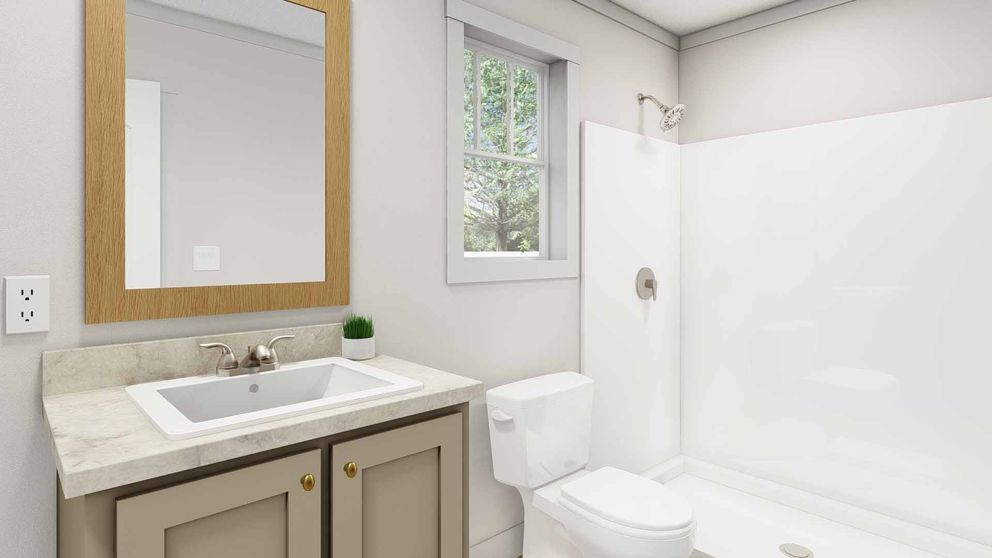 The BORN TO RUN Primary Bathroom. This Manufactured Mobile Home features 2 bedrooms and 2 baths.