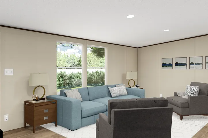 The PRIDE Living Room. This Manufactured Mobile Home features 4 bedrooms and 2 baths.