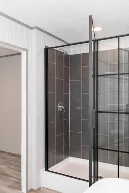 The PLATINUM ANNIVERSARY Primary Bathroom. This Manufactured Mobile Home features 3 bedrooms and 2 baths.