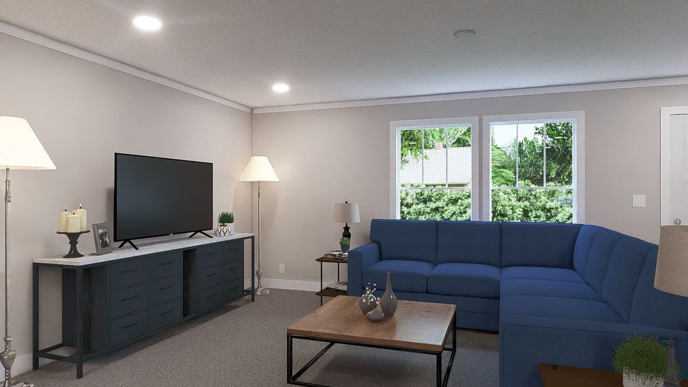 The ROCKET MAN Living Room. This Manufactured Mobile Home features 3 bedrooms and 2 baths.