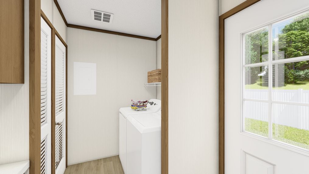 The ESSENCE Utility Room. This Manufactured Mobile Home features 3 bedrooms and 2 baths.