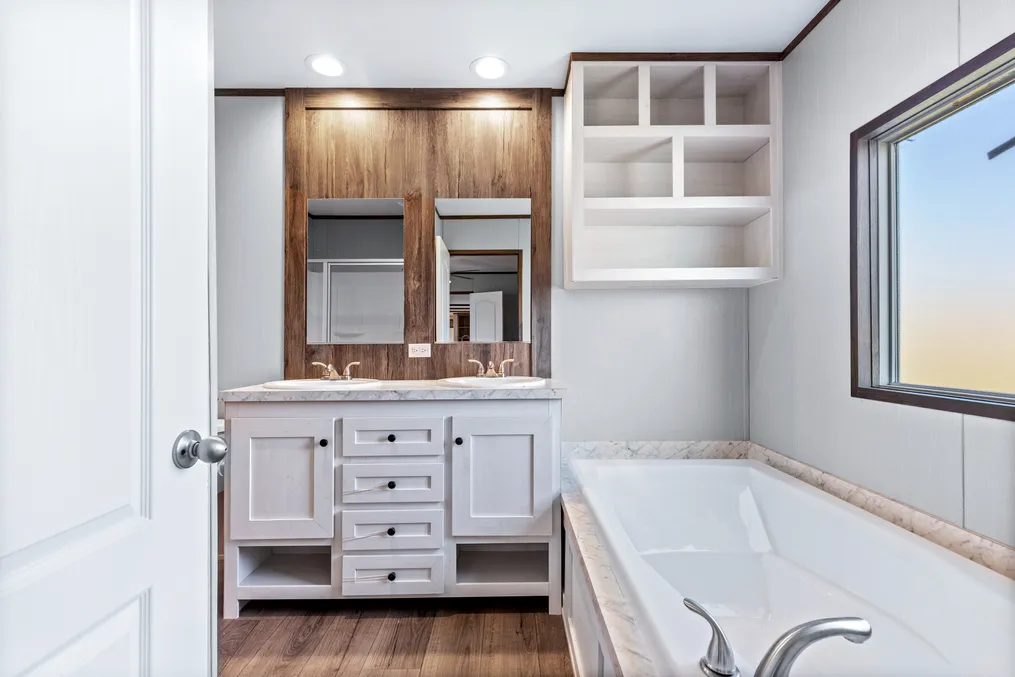 The ANNIVERSARY 16763S Primary Bathroom. This Manufactured Mobile Home features 3 bedrooms and 2 baths.