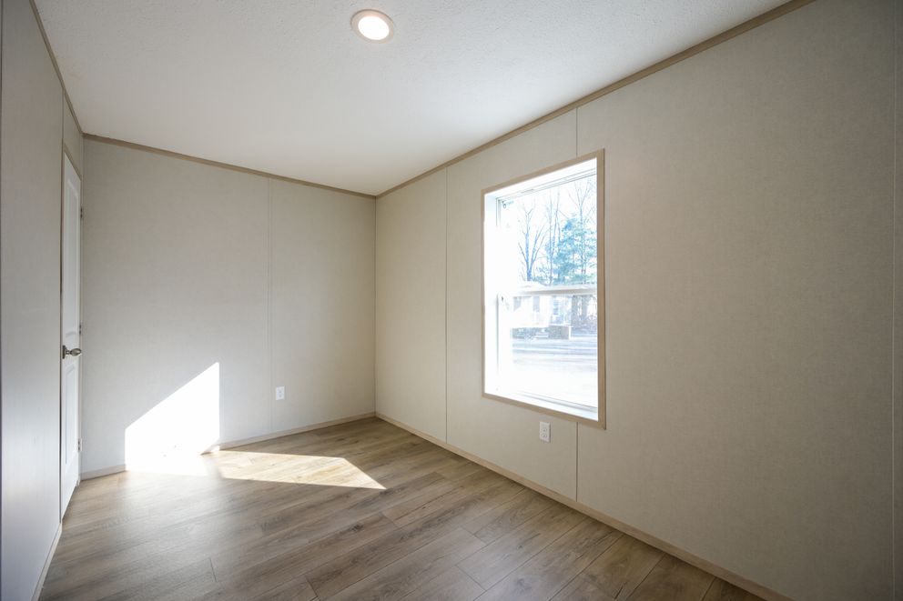 The TIGER'S EYE 7416-456 Guest Bedroom. This Manufactured Mobile Home features 3 bedrooms and 2 baths.