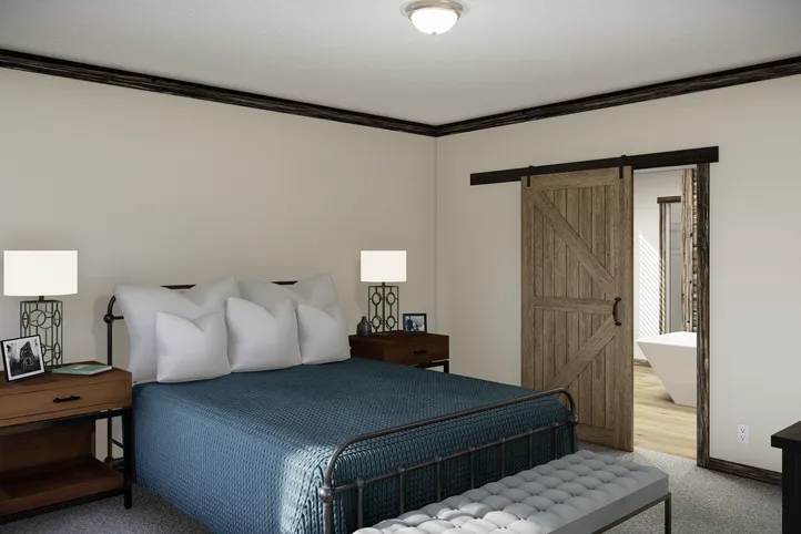 The THE ANDERSON II Primary Bedroom. This Manufactured Mobile Home features 3 bedrooms and 2 baths.