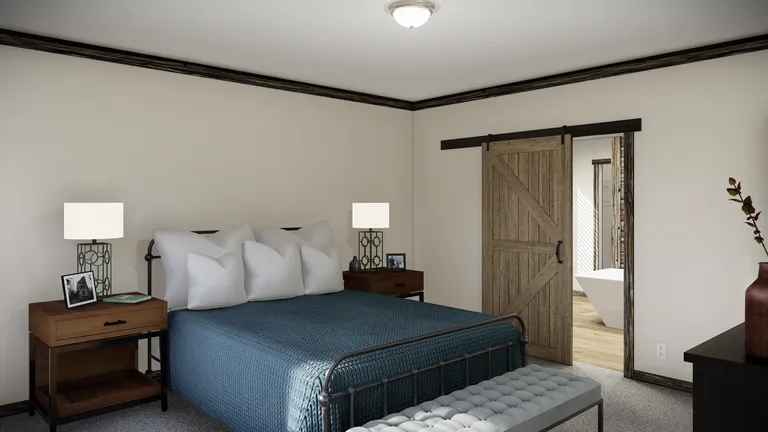 The THE ANDERSON II Primary Bedroom. This Manufactured Mobile Home features 3 bedrooms and 2 baths.