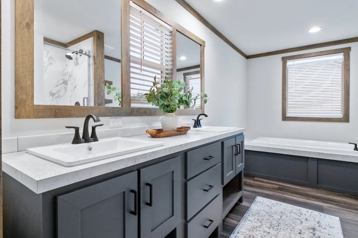 The EVERETT ELITE Primary Bathroom. This Manufactured Mobile Home features 4 bedrooms and 3 baths.