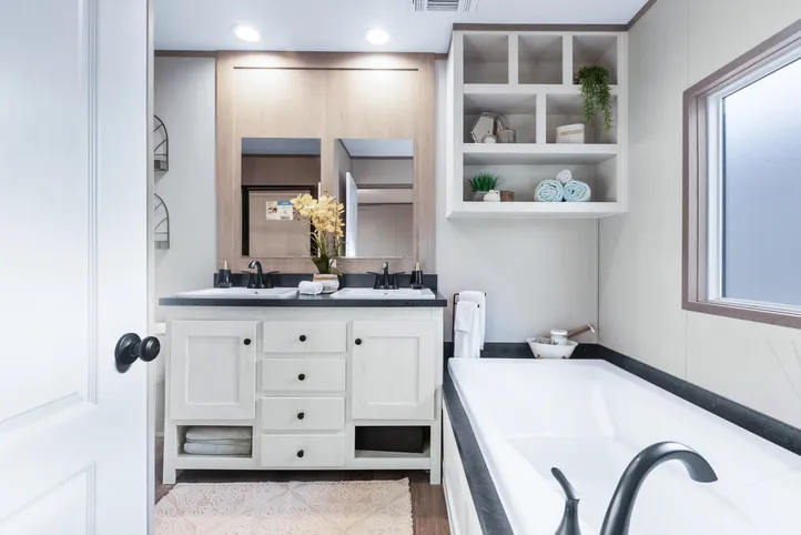 The ANNIVERSARY 16763A Primary Bathroom. This Manufactured Mobile Home features 3 bedrooms and 2 baths.