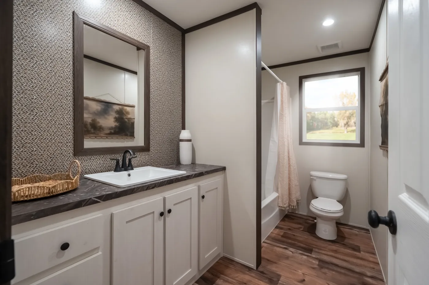 The MOUNTAIN VIEW Guest Bathroom. This Manufactured Mobile Home features 3 bedrooms and 2 baths.