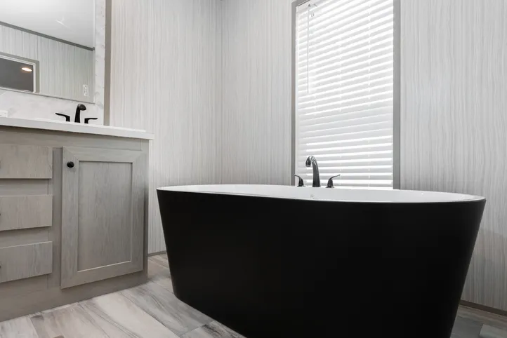 The THE ANNIVERSARY 76 Primary Bathroom. This Manufactured Mobile Home features 3 bedrooms and 2 baths.