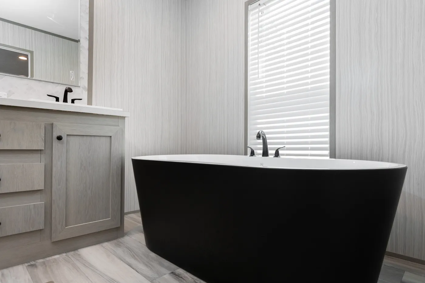 The THE ANNIVERSARY 76 Primary Bathroom. This Manufactured Mobile Home features 3 bedrooms and 2 baths.