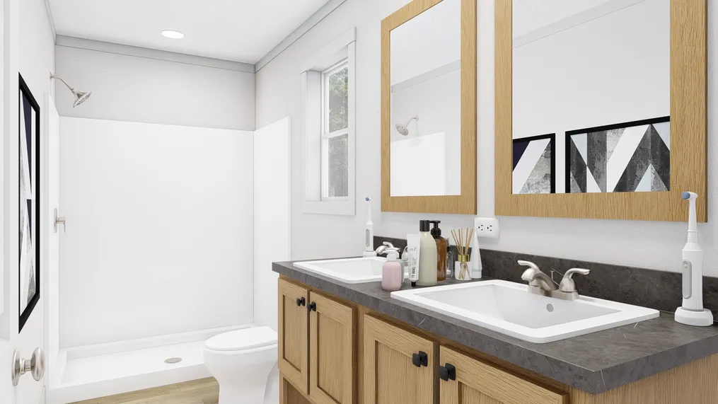 The JOHNNY B GOODE Primary Bathroom. This Manufactured Mobile Home features 3 bedrooms and 2 baths.