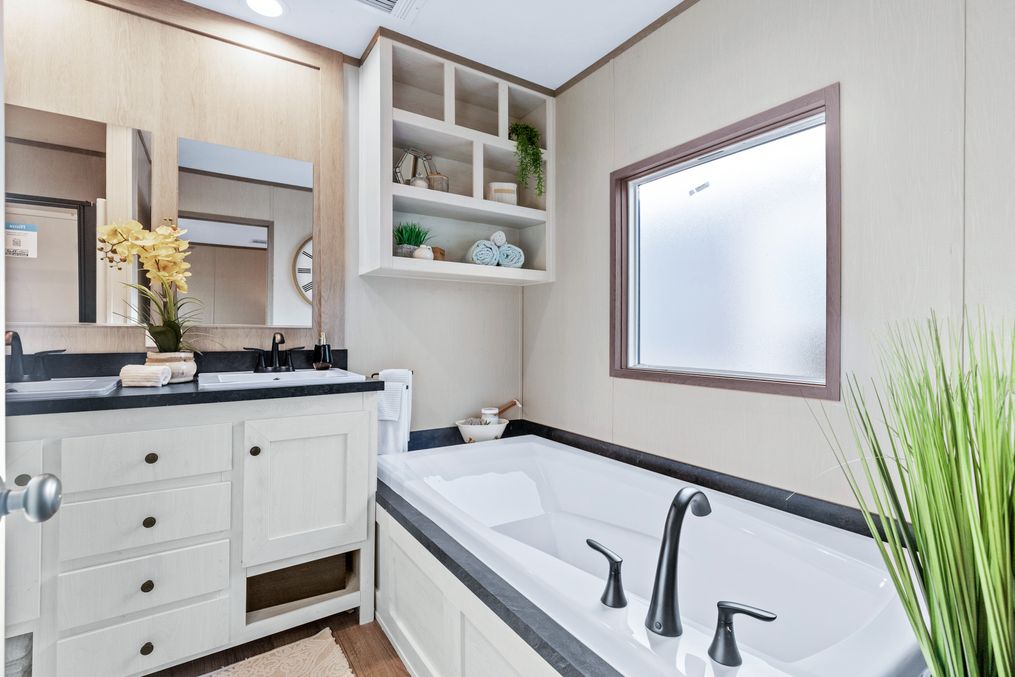The ANNIVERSARY 16763A Primary Bathroom. This Manufactured Mobile Home features 3 bedrooms and 2 baths.