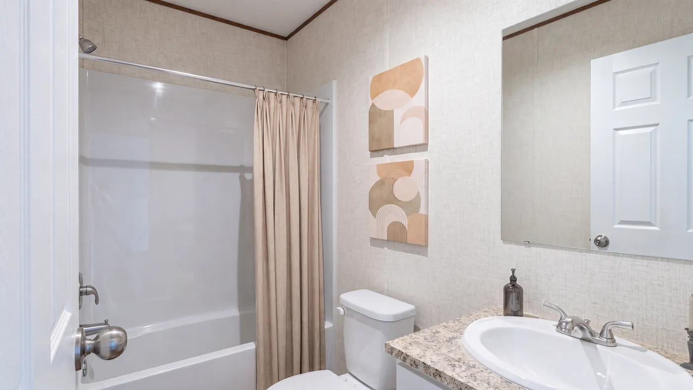 The OAK Guest Bathroom. This Manufactured Mobile Home features 4 bedrooms and 2 baths.