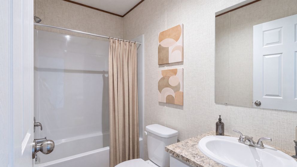 The OAK Guest Bathroom. This Manufactured Mobile Home features 4 bedrooms and 2 baths.