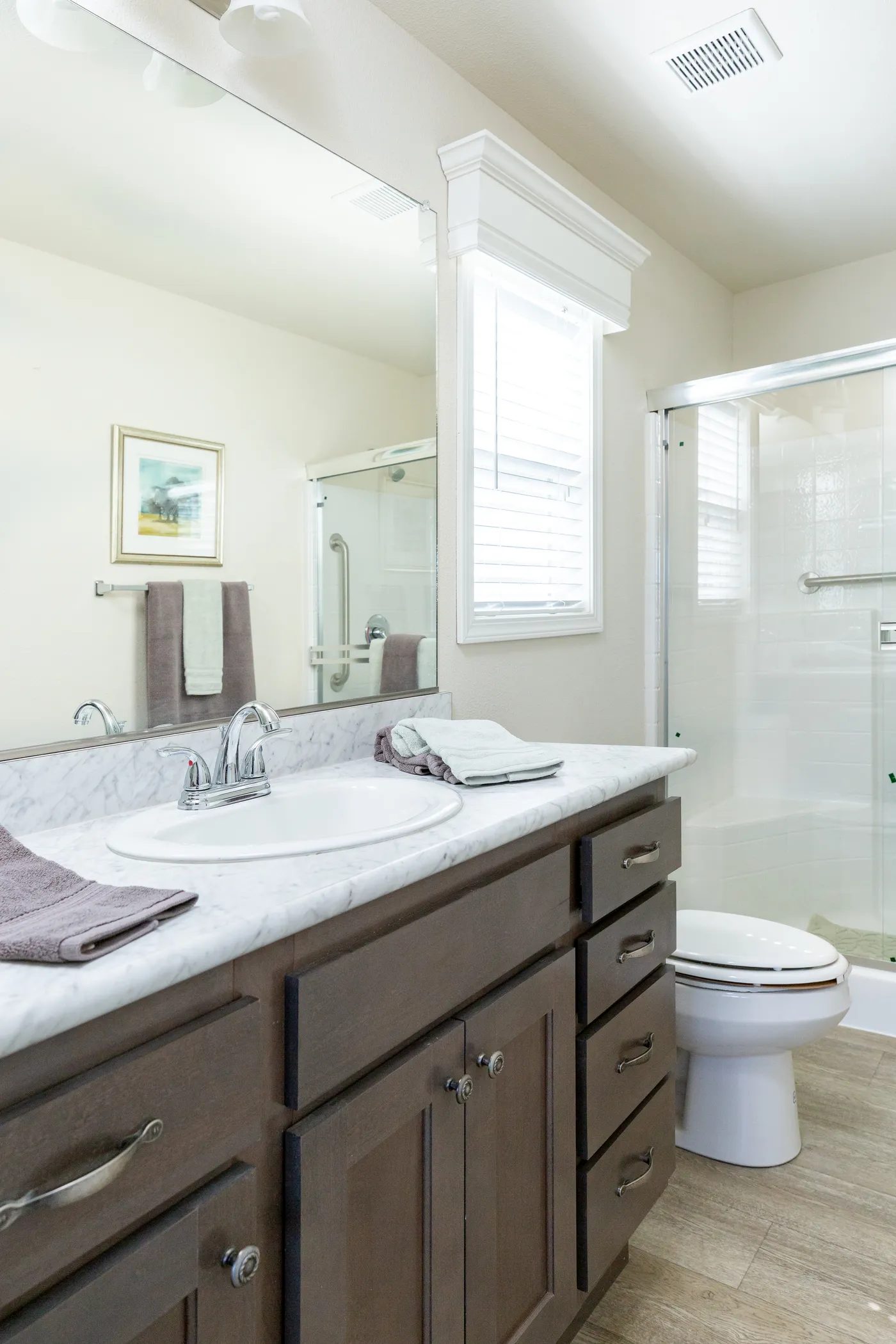 The FAIRPOINT 27543F Primary Bathroom. This Manufactured Mobile Home features 3 bedrooms and 2 baths.