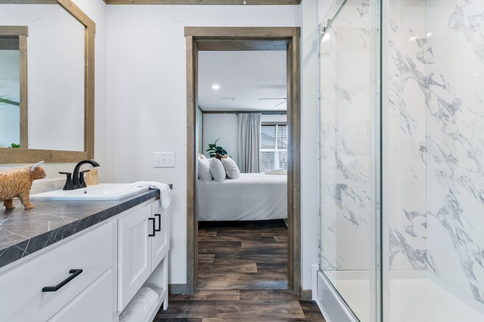 The SAWYER ELITE Primary Bathroom. This Manufactured Mobile Home features 3 bedrooms and 2 baths.
