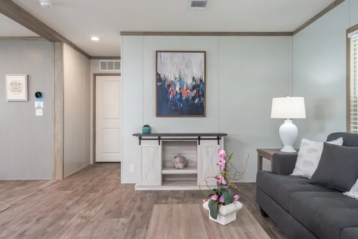 The BLUEBONNET BREEZE Living Room. This Manufactured Mobile Home features 3 bedrooms and 2 baths.