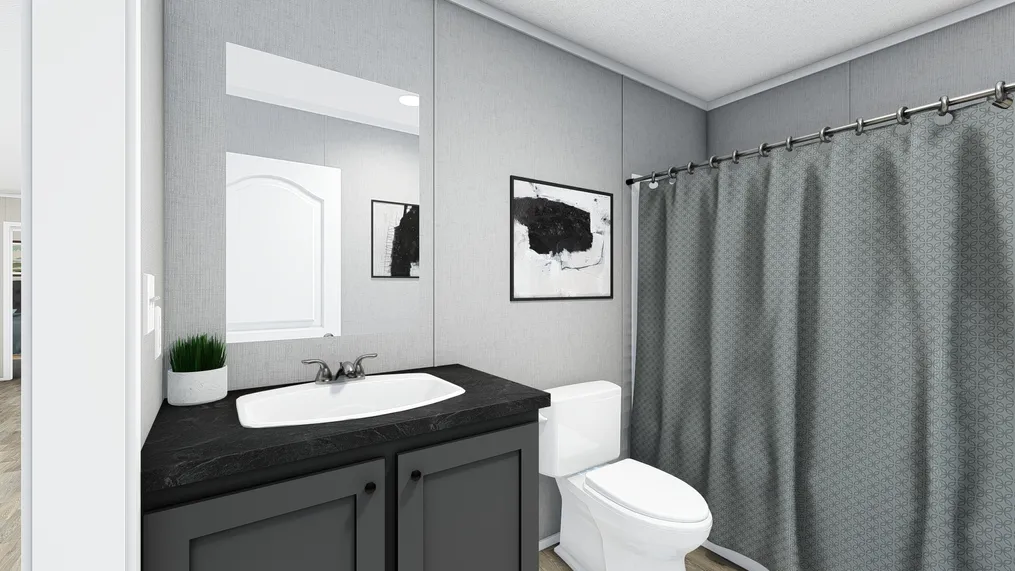 The TRADITION 60B Guest Bathroom. This Manufactured Mobile Home features 3 bedrooms and 2 baths.