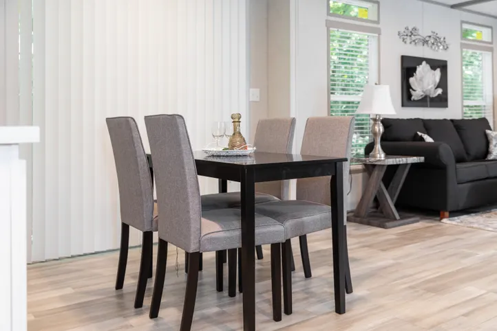 The THE ANNIVERSARY 76 Dining Area. This Manufactured Mobile Home features 3 bedrooms and 2 baths.