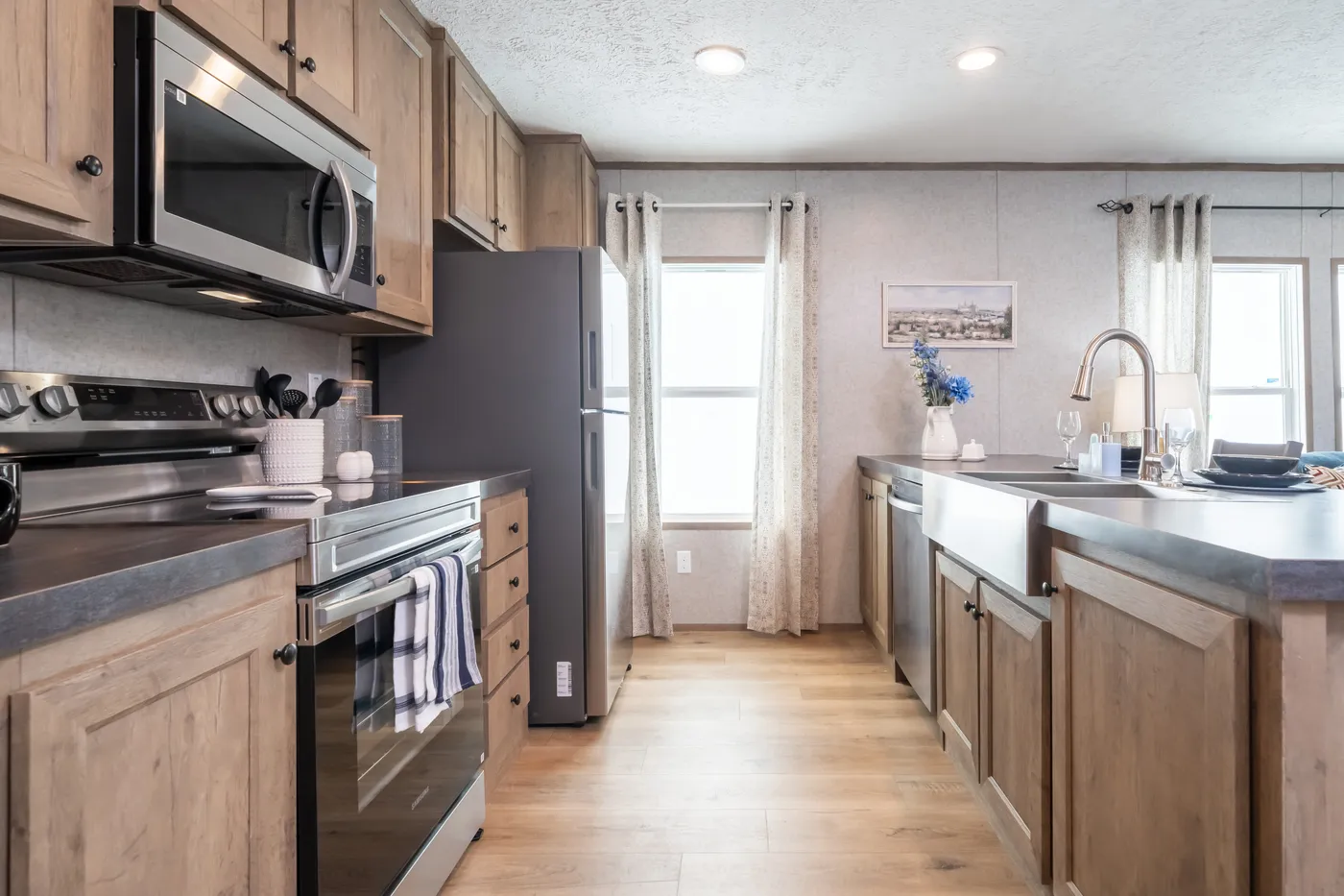 The WARRIOR II Kitchen. This Manufactured Mobile Home features 2 bedrooms and 2 baths.