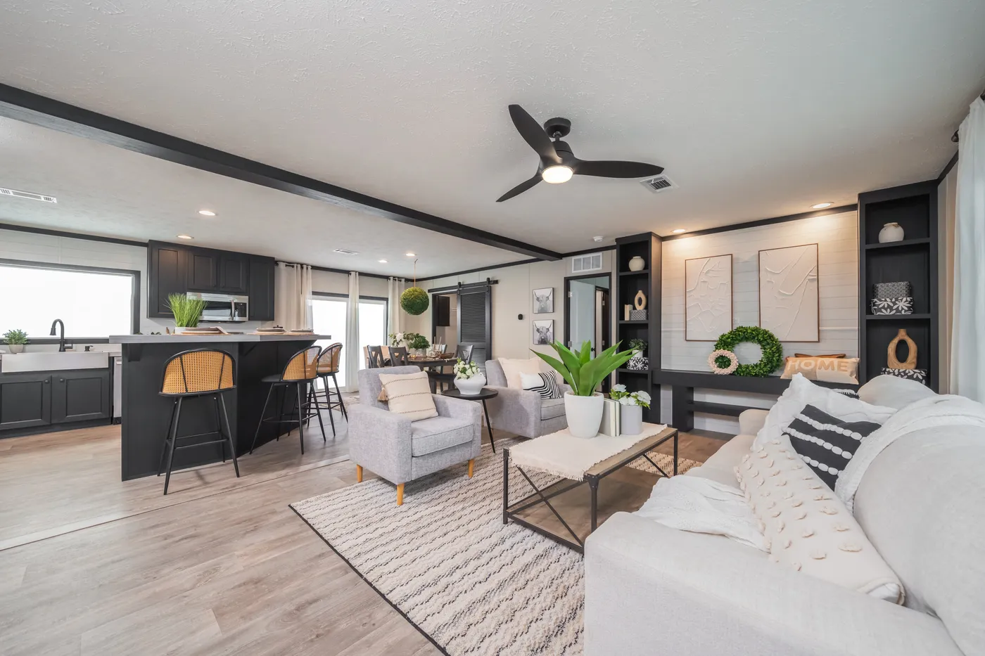The CRAZY EIGHTS Living Room. This Manufactured Mobile Home features 4 bedrooms and 2 baths.