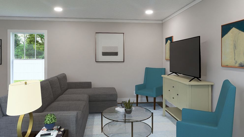 The BORN TO RUN Living Room. This Manufactured Mobile Home features 2 bedrooms and 2 baths.
