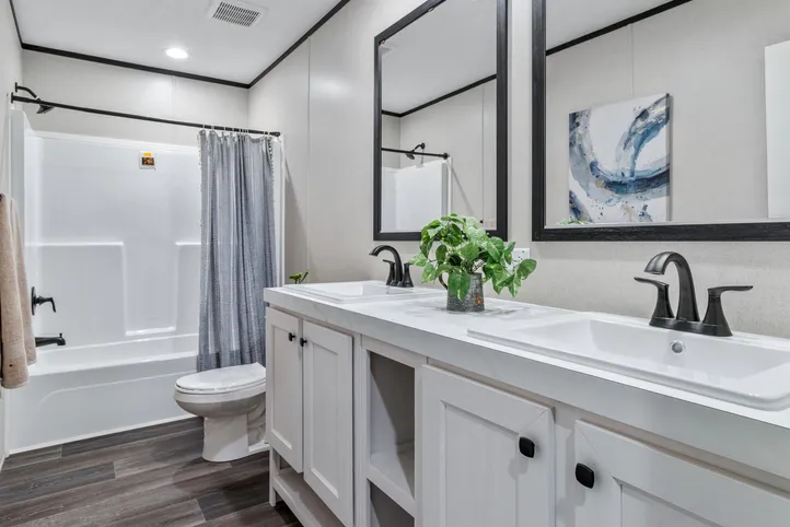 The THE RENEGADE Guest Bathroom. This Manufactured Mobile Home features 3 bedrooms and 2 baths.