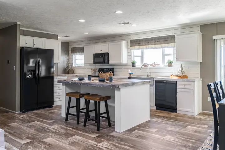 The LOCKLEAR Exterior. This Manufactured Mobile Home features 4 bedrooms and 2 baths.
