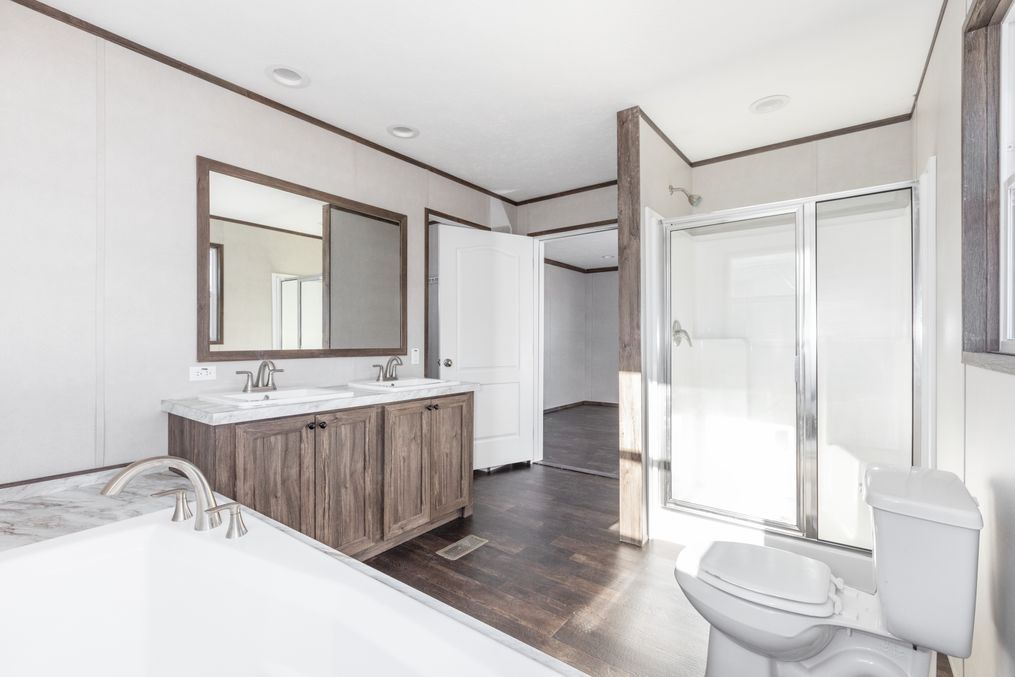 The NAVIGATOR Primary Bathroom. This Manufactured Mobile Home features 3 bedrooms and 2 baths.