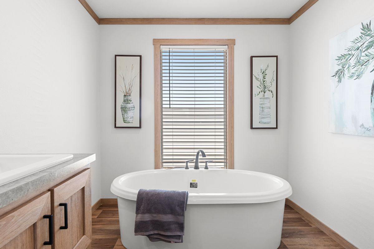 The LORALEI Primary Bathroom. This Manufactured Mobile Home features 3 bedrooms and 2 baths.