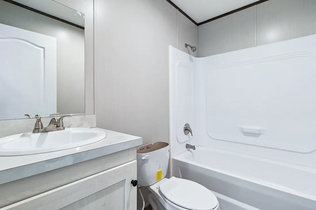 The HOMESTEAD 16562A Guest Bathroom. This Manufactured Mobile Home features 2 bedrooms and 2 baths.