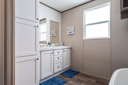 The FARMHOUSE BREEZE 72 Primary Bathroom. This Manufactured Mobile Home features 4 bedrooms and 2 baths.