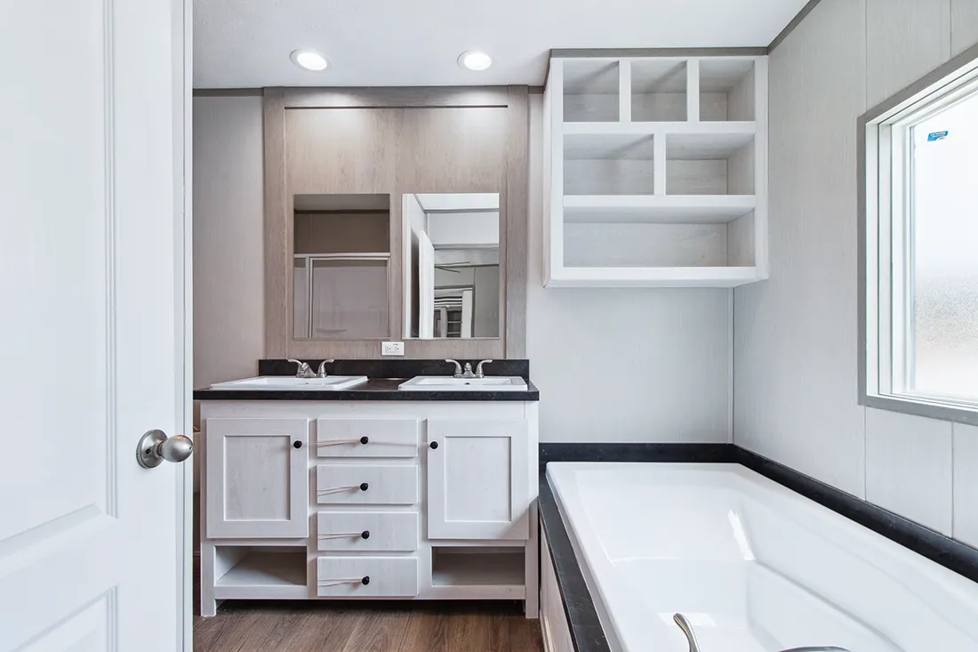 The ANNIVERSARY 16682F Primary Bathroom. This Manufactured Mobile Home features 2 bedrooms and 2 baths.