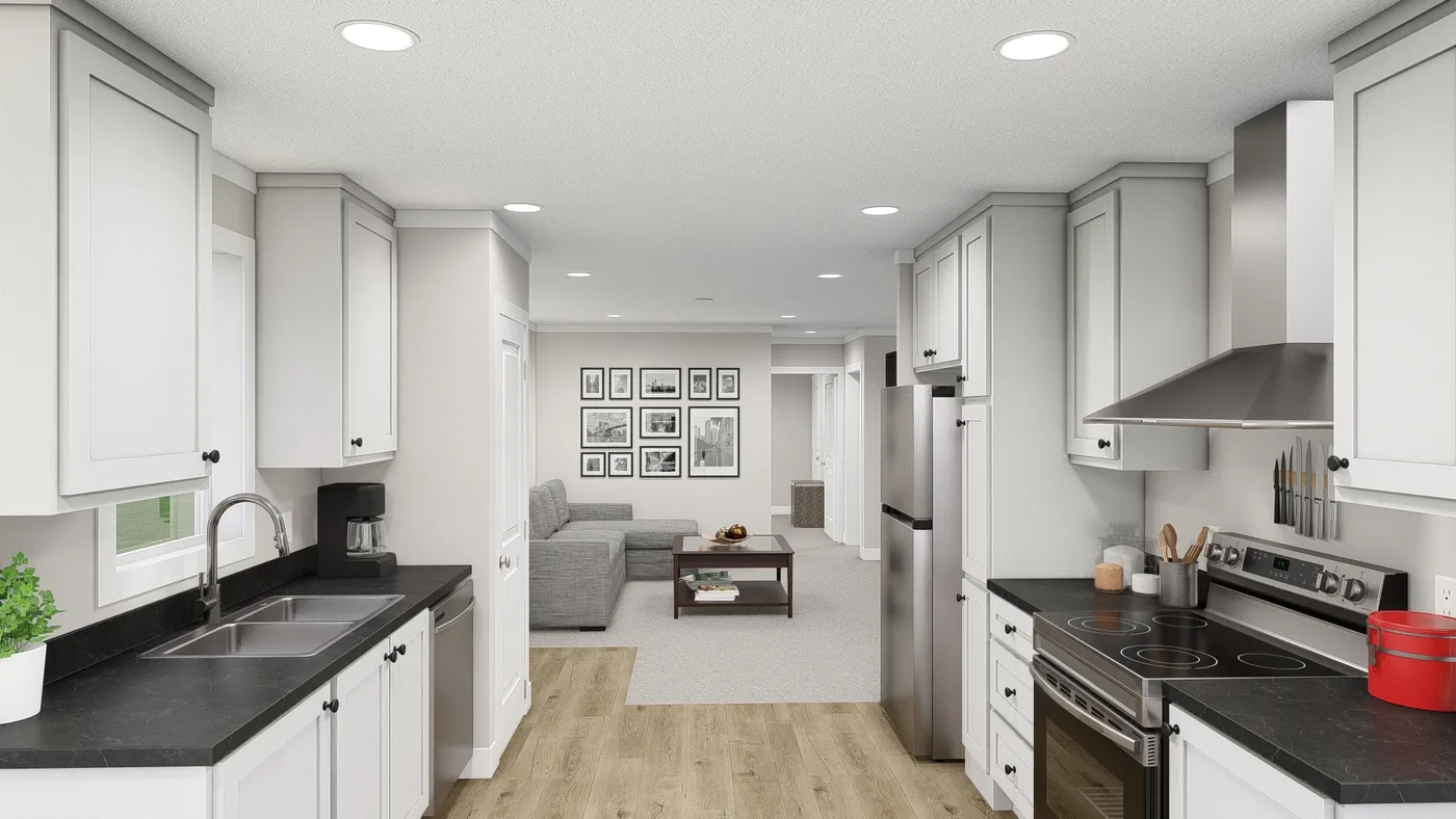 The HERE COMES THE SUN Kitchen. This Manufactured Mobile Home features 3 bedrooms and 2 baths.